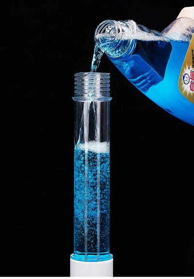 BARESY cordless electric cleaning brush with clear reservoir being filled with blue cleaning liquid
