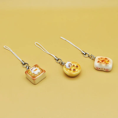 BARESY smartphone cat accessories trio of food themed charm straps featuring small cat in toast pancake pastry