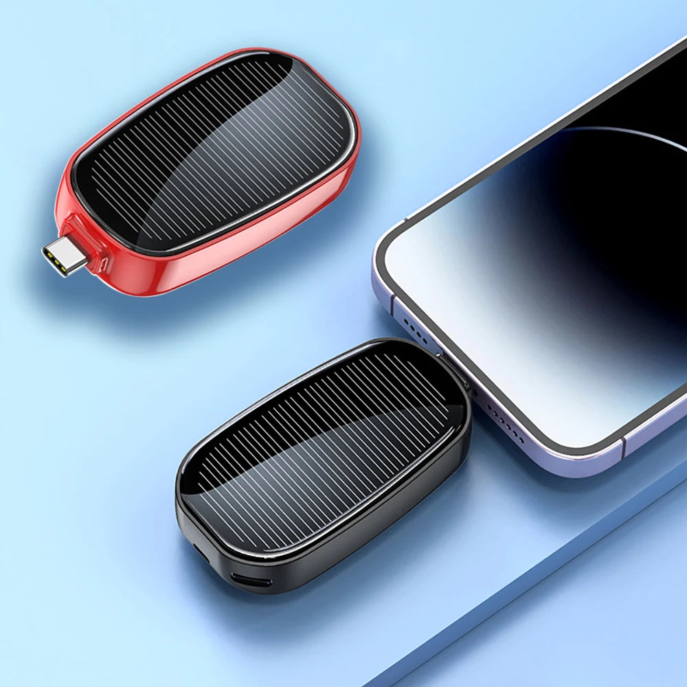 BARESY compact solar emergency phone power bank 1200mAh in red and black next to smartphone