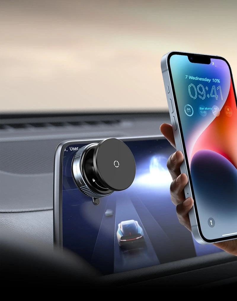 BARESY magnetic phone mount for car attached to dashboard display with round black magnet and hand holding iPhone