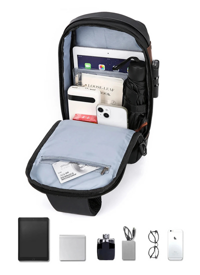BARESY men's waterproof crossbody bag with USB port in black open to show tablet phone power bank and organized pockets